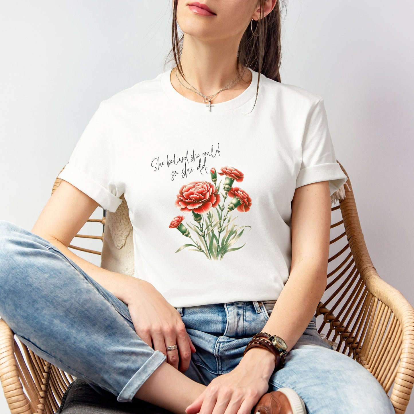 A t-shirt featuring a beautiful carnation for January with the quote “She believed she could, so she did.” Perfect for January birthdays and floral art lovers. Comfortable and stylish for casual outings or celebrations. Bella+Canvas 3001 t-shirt in white. ReadyShirtAim.com