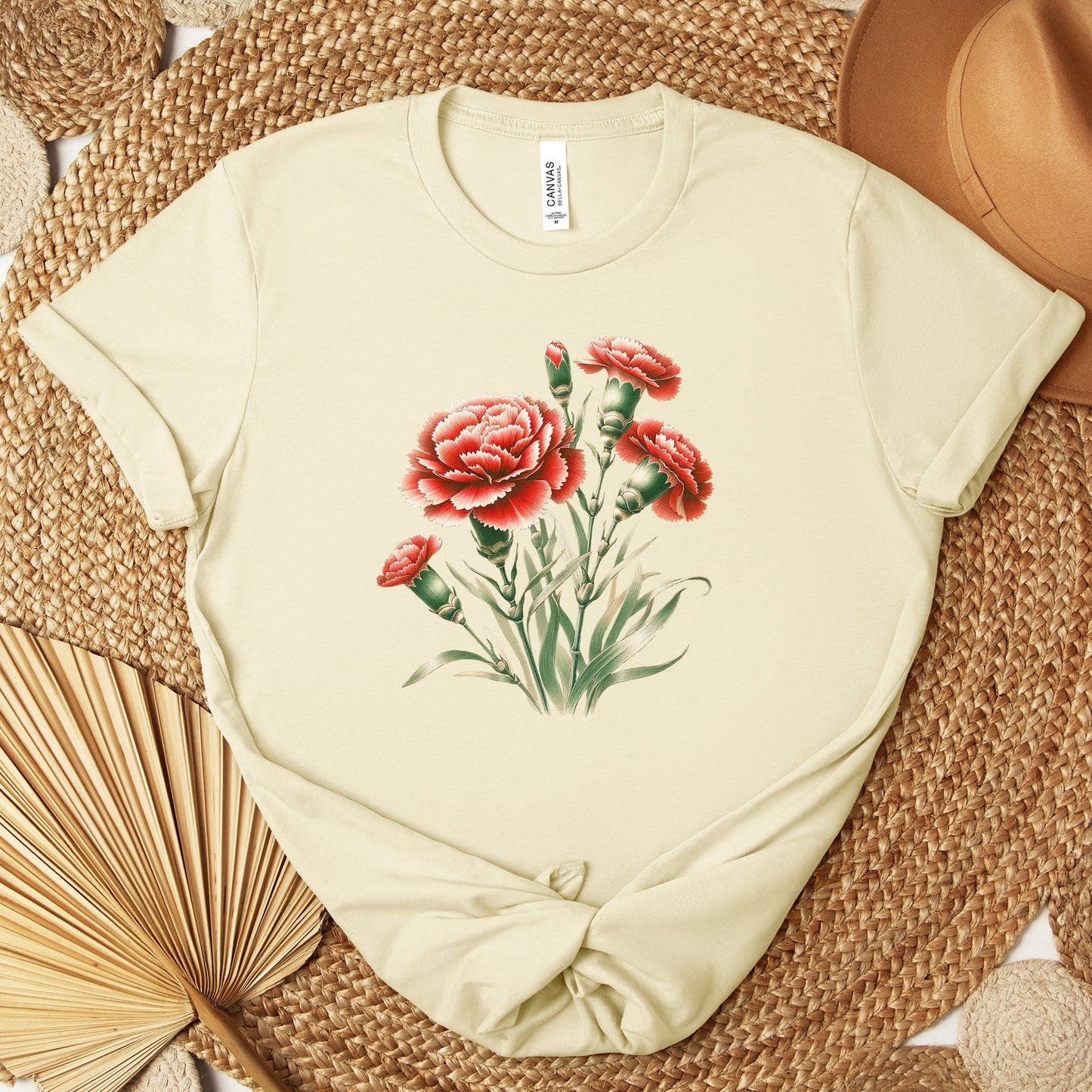 A t-shirt featuring a beautiful carnation for January. Perfect for January birthdays and floral art lovers. Comfortable and stylish for casual outings or celebrations. Bella+Canvas 3001 t-shirt in natural. ReadyShirtAim.com