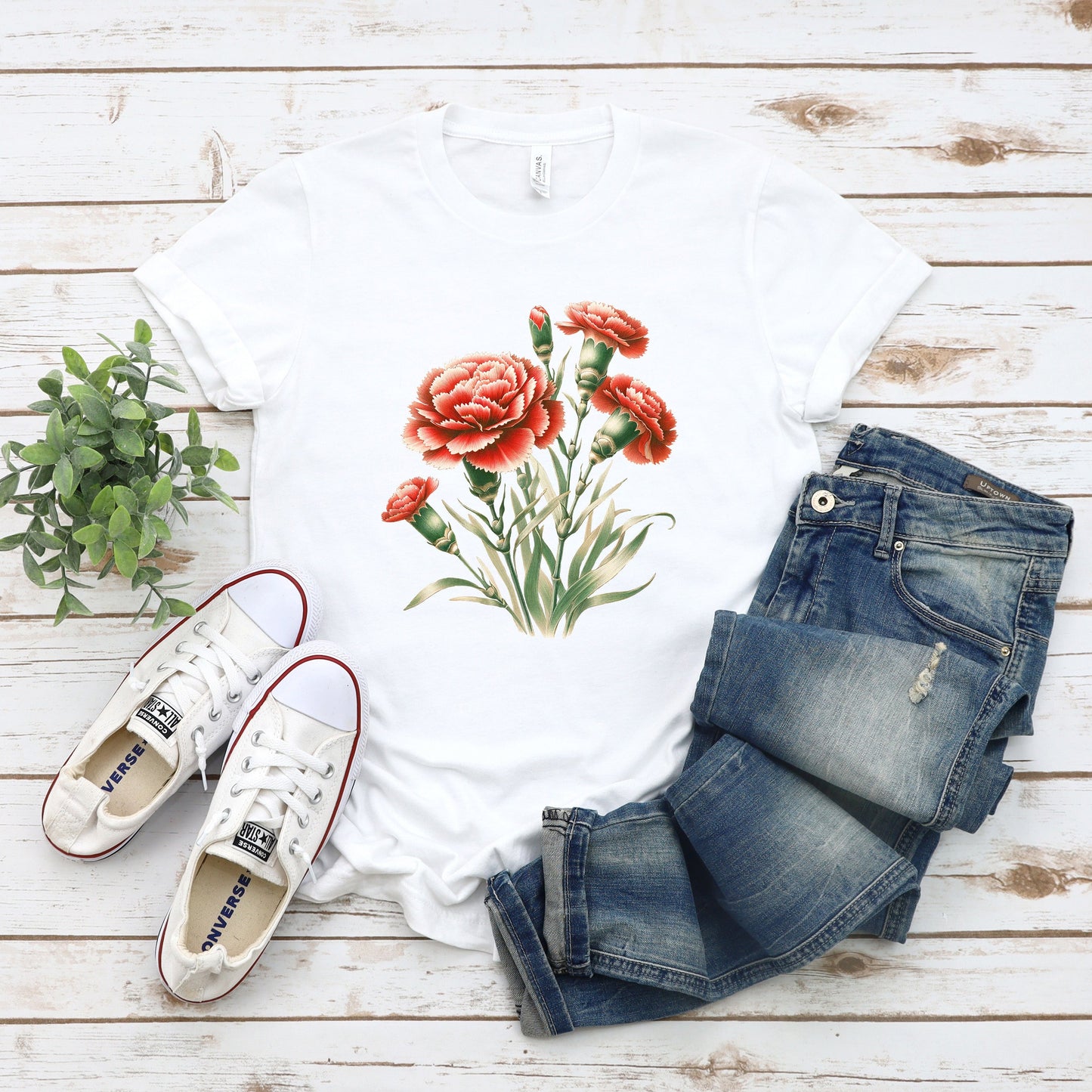 A t-shirt featuring a beautiful carnation for January. Perfect for January birthdays and floral art lovers. Comfortable and stylish for casual outings or celebrations. Bella+Canvas 3001 t-shirt in white. ReadyShirtAim.com