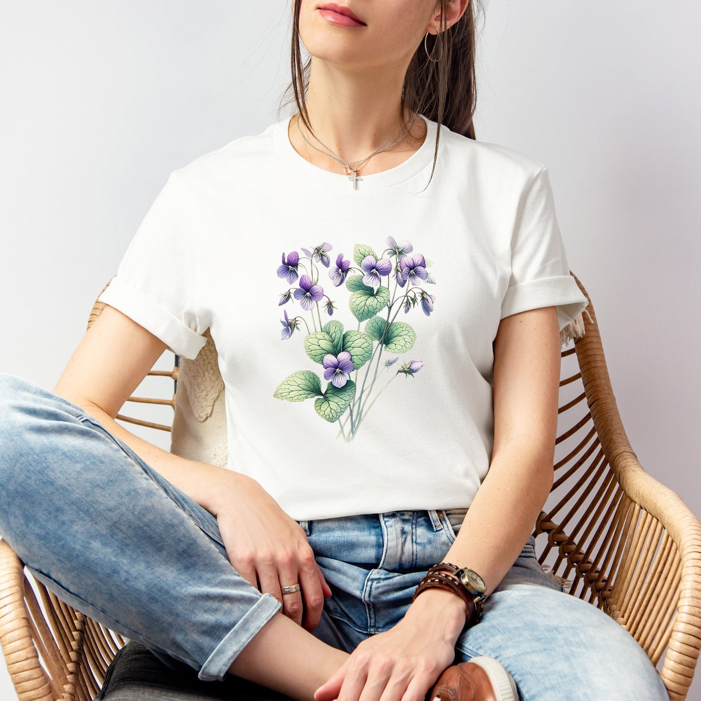 A t-shirt featuring a beautiful violet for February. Perfect for February birthdays and floral art lovers. Comfortable and stylish for casual outings or celebrations. Bella+Canvas 3001 t-shirt in white. ReadyShirtAim.com