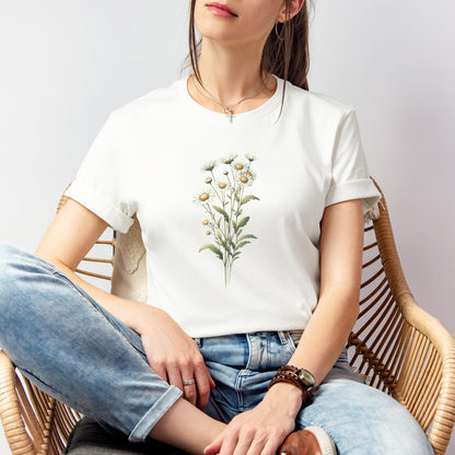 A t-shirt featuring a beautiful daisy for April. Perfect for April birthdays and floral art lovers. Comfortable and stylish for casual outings or celebrations. Bella+Canvas 3001 t-shirt in white. ReadyShirtAim.com