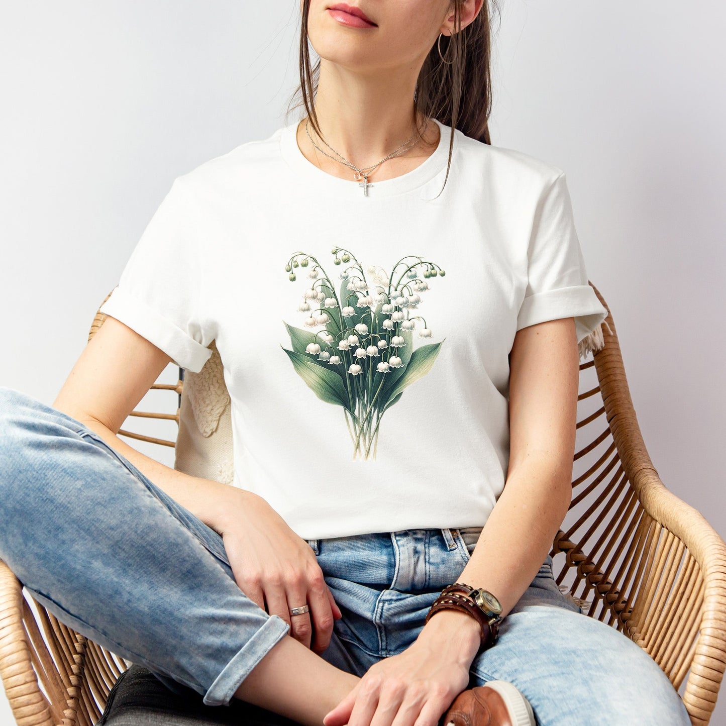 A t-shirt featuring a beautiful Lily of the Valley for May. Perfect for May birthdays and floral art lovers. Comfortable and stylish for casual outings or celebrations. Bella+Canvas 3001 t-shirt in white. ReadyShirtAim.com