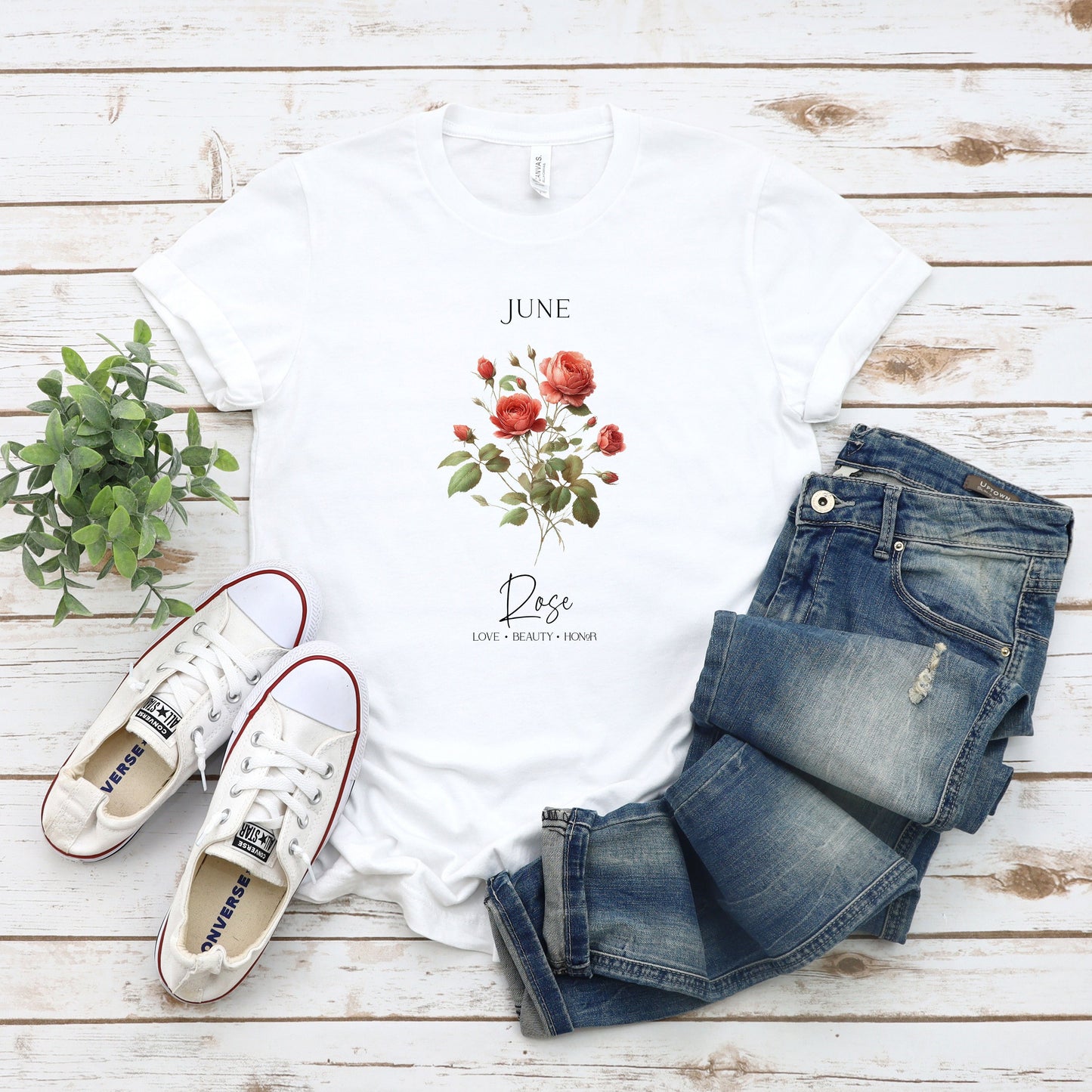 A t-shirt featuring a beautiful rose for June with traits Love, Beauty, Honor. Perfect for June birthdays and floral art lovers. Comfortable and stylish for casual outings or celebrations. Bella+Canvas 3001 t-shirt in white. ReadyShirtAim.com