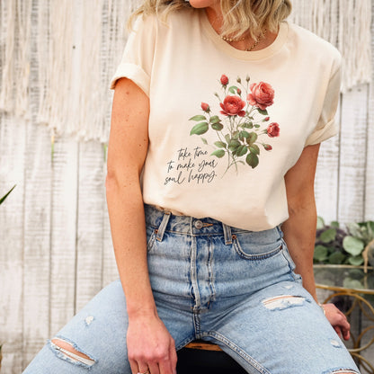 A t-shirt featuring a beautiful rose for June with the quote “Take time to make your soul happy.” Perfect for June birthdays and floral art lovers. Comfortable and stylish for casual outings or celebrations. Bella+Canvas 3001 t-shirt in soft cream. ReadyShirtAim.com