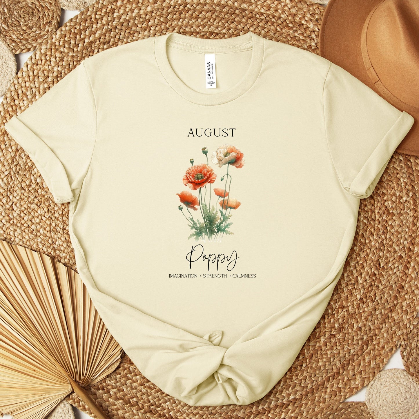 A t-shirt featuring a beautiful poppy for August with traits Imagination, Strength, Calmness. Perfect for August birthdays and floral art lovers. Comfortable and stylish for casual outings or celebrations. Bella+Canvas 3001 t-shirt in natural. ReadyShirtAim.com