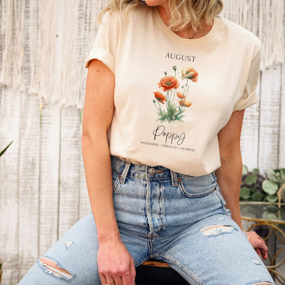 A t-shirt featuring a beautiful poppy for August with traits Imagination, Strength, Calmness. Perfect for August birthdays and floral art lovers. Comfortable and stylish for casual outings or celebrations. Bella+Canvas 3001 t-shirt in soft cream. ReadyShirtAim.com