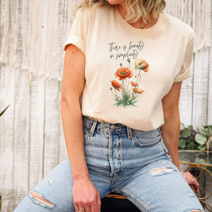 A t-shirt featuring a beautiful poppy for August with the quote “There is beauty in simplicity.” Perfect for August birthdays and floral art lovers. Comfortable and stylish for casual outings or celebrations. Bella+Canvas 3001 t-shirt in soft cream. ReadyShirtAim.com