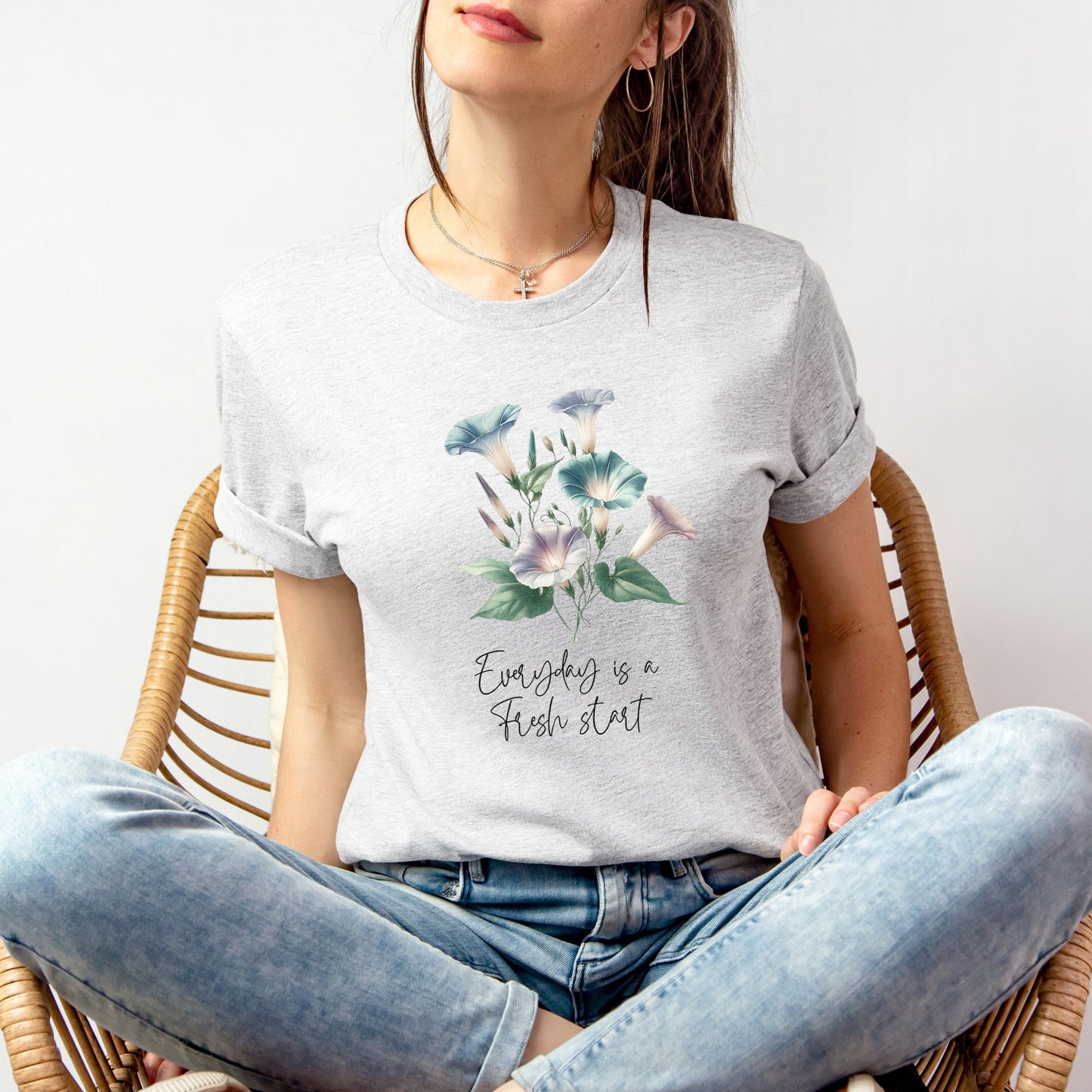 A t-shirt featuring a beautiful morning glory for September with the quote “Everyday is a fresh start.” Perfect for September birthdays and floral art lovers. Comfortable and stylish for casual outings or celebrations. Bella+Canvas 3001 t-shirt in ash. ReadyShirtAim.com