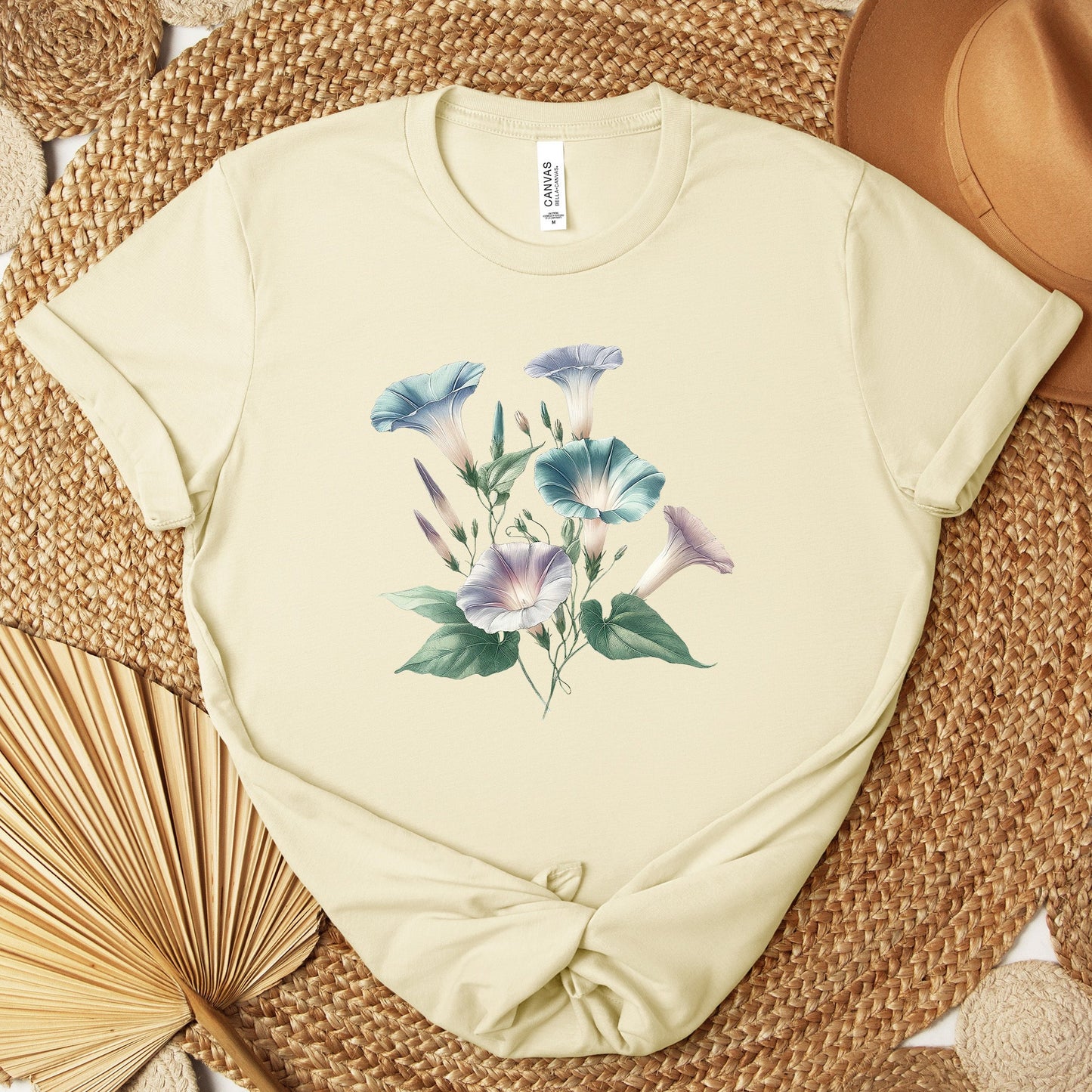 A t-shirt featuring a beautiful morning glory for September. Perfect for September birthdays and floral art lovers. Comfortable and stylish for casual outings or celebrations. Bella+Canvas 3001 t-shirt in natural. ReadyShirtAim.com