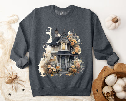 Halloween Boho Sweatshirt for Women featuring a haunted house illustration with boho design elements. Perfect for autumn festivities and casual wear. Available in multiple dark and light colors and sizes. Gildan 18000 sweatshirt in Dark Grey Heather. ReadyShirtAim.com