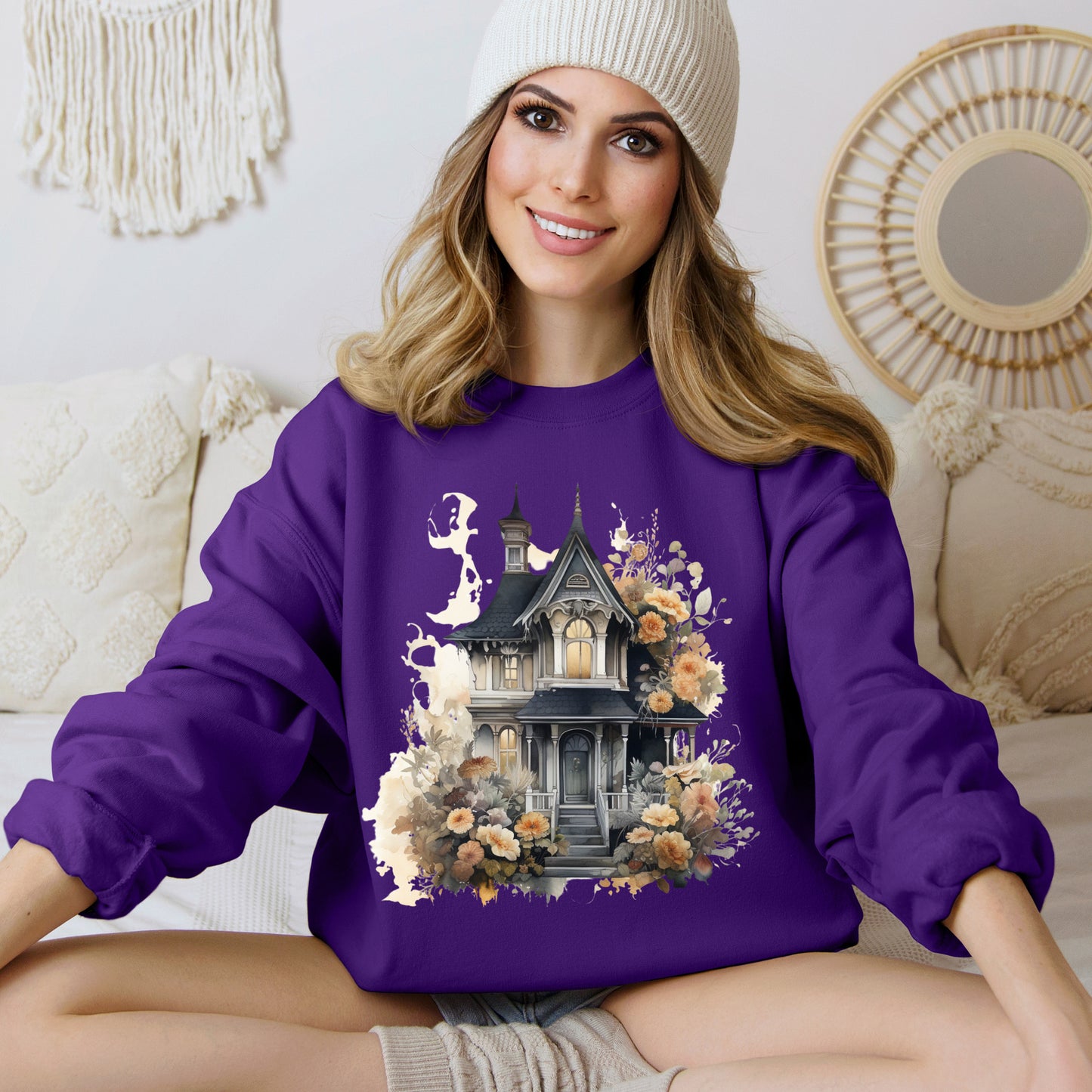 Halloween Boho Sweatshirt for Women featuring a haunted house illustration with boho design elements. Perfect for autumn festivities and casual wear. Gildan 18000 sweatshirt in Purple. ReadyShirtAim.com