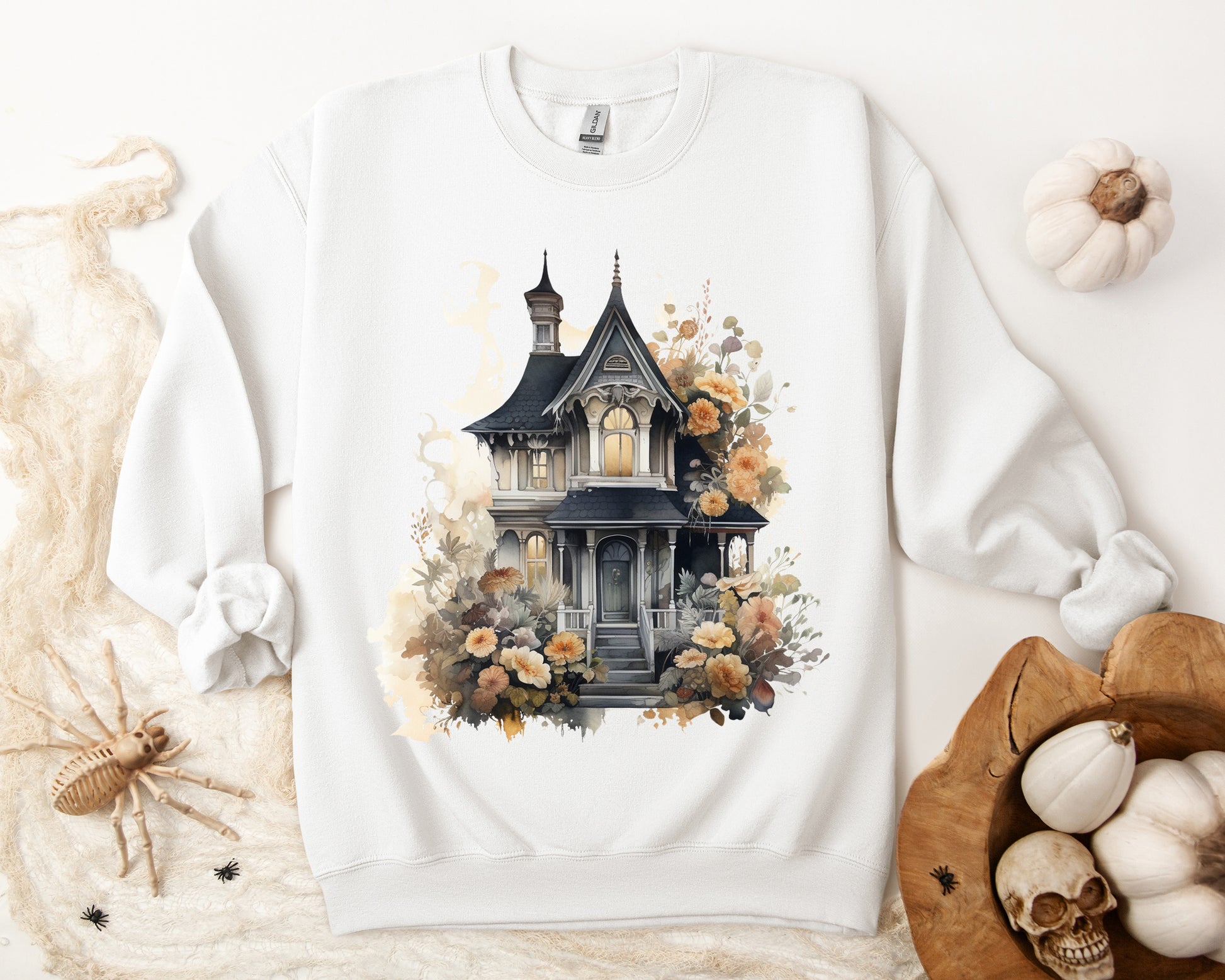 Halloween Boho Sweatshirt for Women featuring a haunted house illustration with boho design elements. Perfect for autumn festivities and casual wear. Gildan 18000 sweatshirt in White. ReadyShirtAim.com