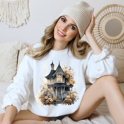 Halloween Boho Sweatshirt for Women featuring a haunted house illustration with boho design elements. Perfect for autumn festivities and casual wear. Gildan 18000 sweatshirt in White. ReadyShirtAim.com