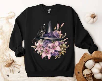 Enchanting Bohemian Witch Hat Sweatshirt with a watercolor illustration of a black witch hat surrounded by flowers in purple, pink, and green tones. Available in multiple dark ang light colors and sizes. Gildan 18000 sweatshirt in Black. ReadyShirtAim.com