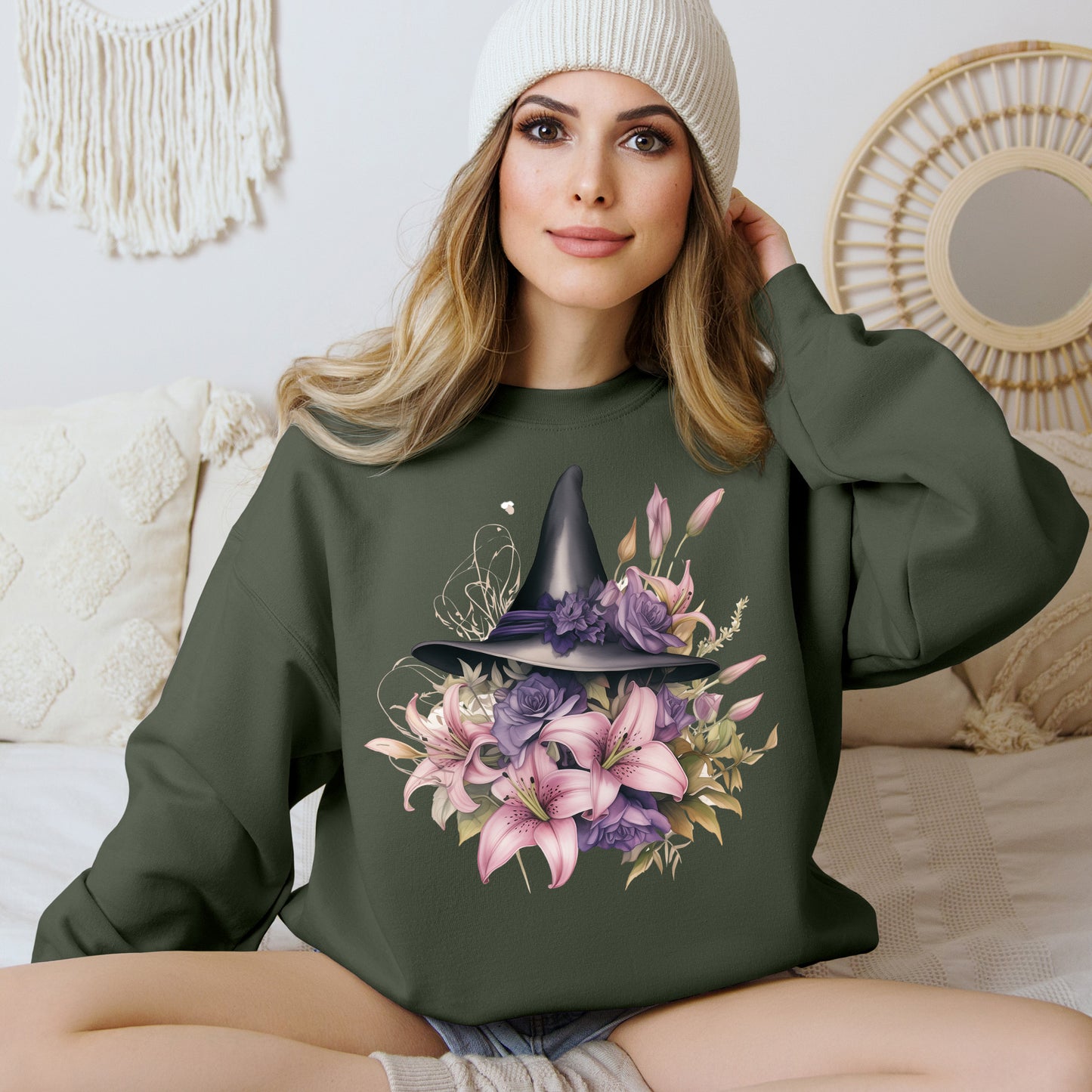 Enchanting Bohemian Witch Hat Sweatshirt with a watercolor illustration of a black witch hat surrounded by flowers in purple, pink, and green tones. Available in multiple dark ang light colors and sizes. Gildan 18000 sweatshirt in Military Green. ReadyShirtAim.com