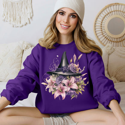 Enchanting Bohemian Witch Hat Sweatshirt with a watercolor illustration of a black witch hat surrounded by flowers in purple, pink, and green tones. Available in multiple dark ang light colors and sizes. Gildan 18000 sweatshirt in Purple. ReadyShirtAim.com