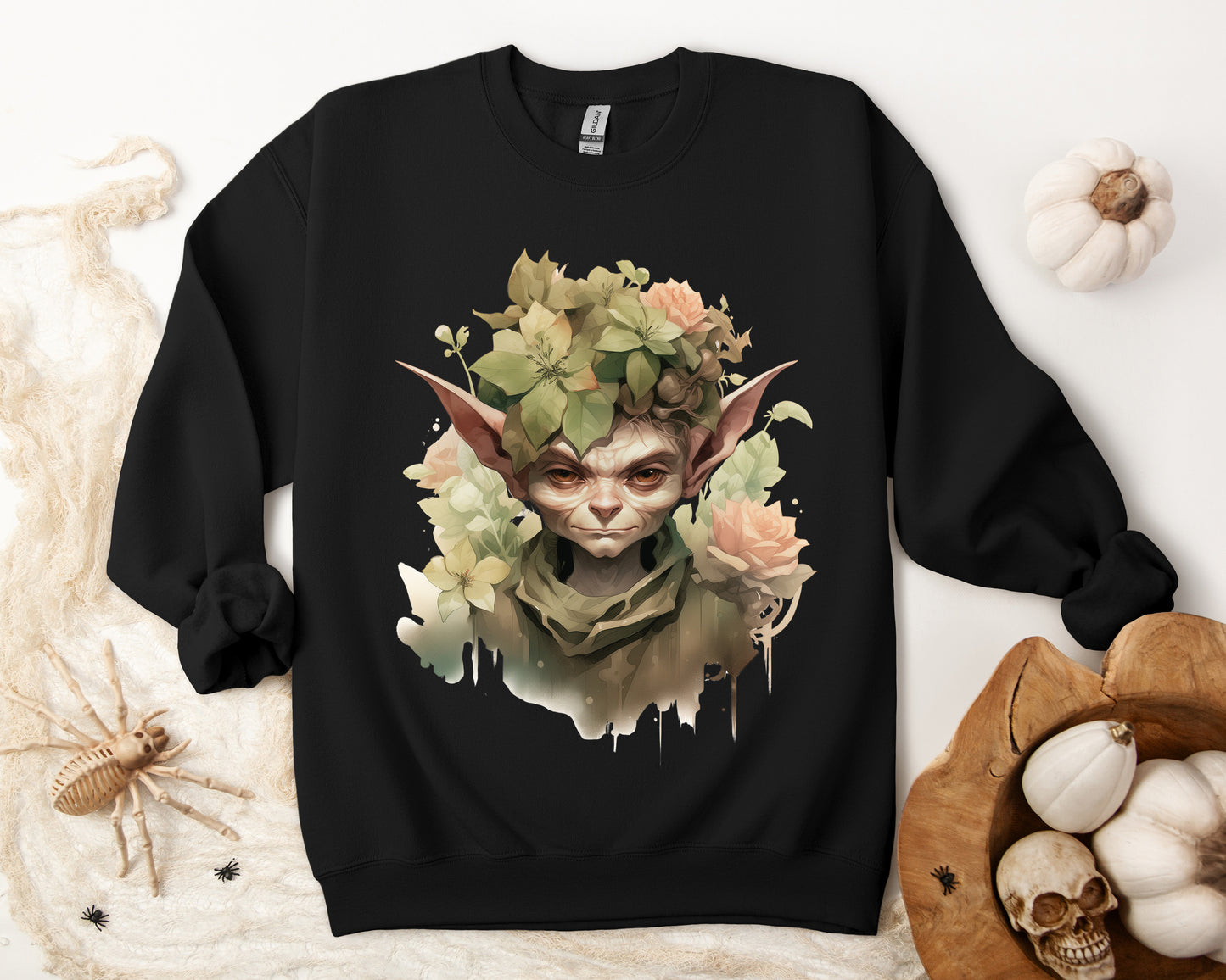 Whimsical Goblin & Floral Boho Halloween Sweatshirt for women. Features a charming goblin surrounded by delicate florals. Perfect for Halloween celebrations. Available in multiple dark and light colors and sizes. Gildan 18000 sweatshirt in Black. ReadyShirtAim.com