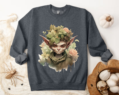 Whimsical Goblin & Floral Boho Halloween Sweatshirt for women. Features a charming goblin surrounded by delicate florals. Perfect for Halloween celebrations. Available in multiple dark and light colors and sizes. Gildan 18000 sweatshirt in Dark Grey Heather. ReadyShirtAim.com