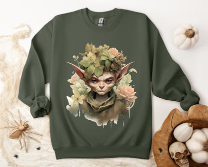 Whimsical Goblin & Floral Boho Halloween Sweatshirt for women. Features a charming goblin surrounded by delicate florals. Perfect for Halloween celebrations. Available in multiple dark and light colors and sizes. Gildan 18000 sweatshirt in Military Green. ReadyShirtAim.com