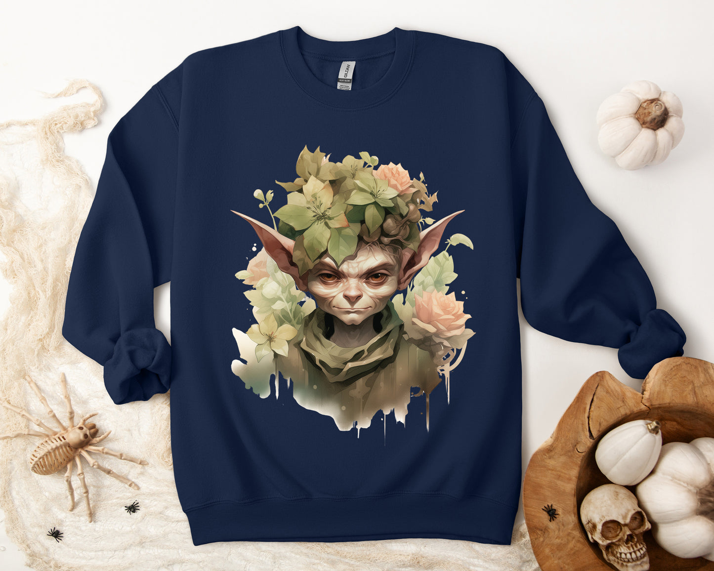 Whimsical Goblin & Floral Boho Halloween Sweatshirt for women. Features a charming goblin surrounded by delicate florals. Perfect for Halloween celebrations. Available in multiple dark and light colors and sizes. Gildan 18000 sweatshirt in Navy. ReadyShirtAim.com