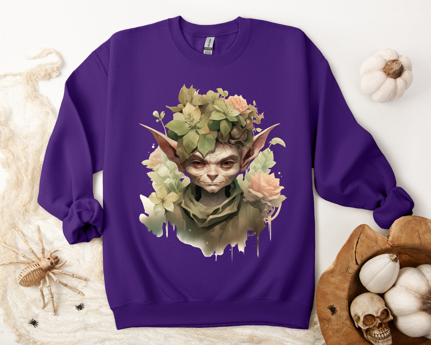 Whimsical Goblin & Floral Boho Halloween Sweatshirt for women. Features a charming goblin surrounded by delicate florals. Perfect for Halloween celebrations. Available in multiple dark and light colors and sizes. Gildan 18000 sweatshirt in Purple. ReadyShirtAim.com