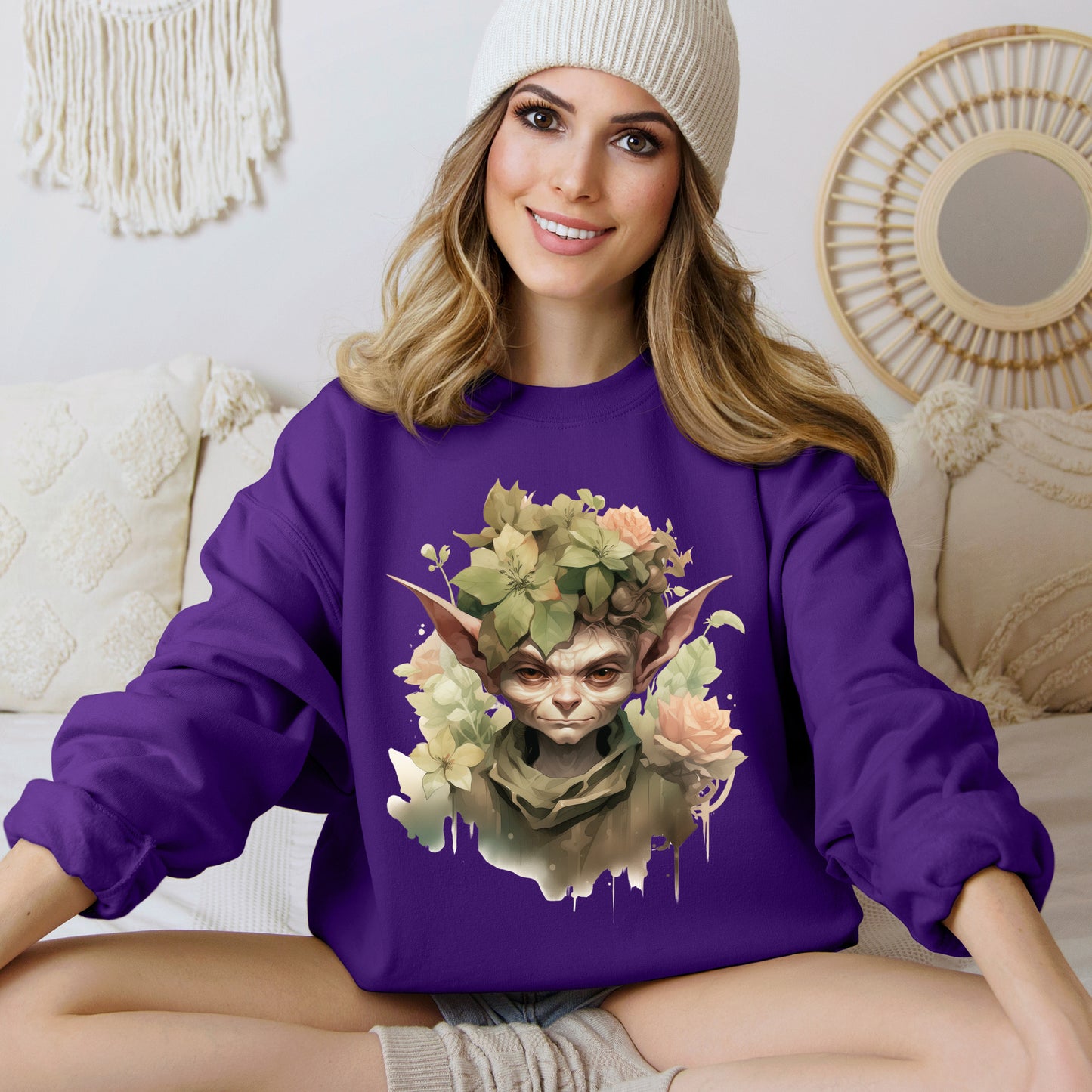 Whimsical Goblin & Floral Boho Halloween Sweatshirt for women. Features a charming goblin surrounded by delicate florals. Perfect for Halloween celebrations. Available in multiple dark and light colors and sizes. Gildan 18000 sweatshirt in Purple. ReadyShirtAim.com