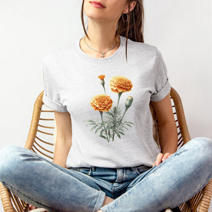 A t-shirt featuring a beautiful marigold for October. Perfect for October birthdays and floral art lovers. Comfortable and stylish for casual outings or celebrations. Bella+Canvas 3001 t-shirt in ash. ReadyShirtAim.com