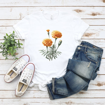 A t-shirt featuring a beautiful marigold for October. Perfect for October birthdays and floral art lovers. Comfortable and stylish for casual outings or celebrations. Bella+Canvas 3001 t-shirt in white. ReadyShirtAim.com