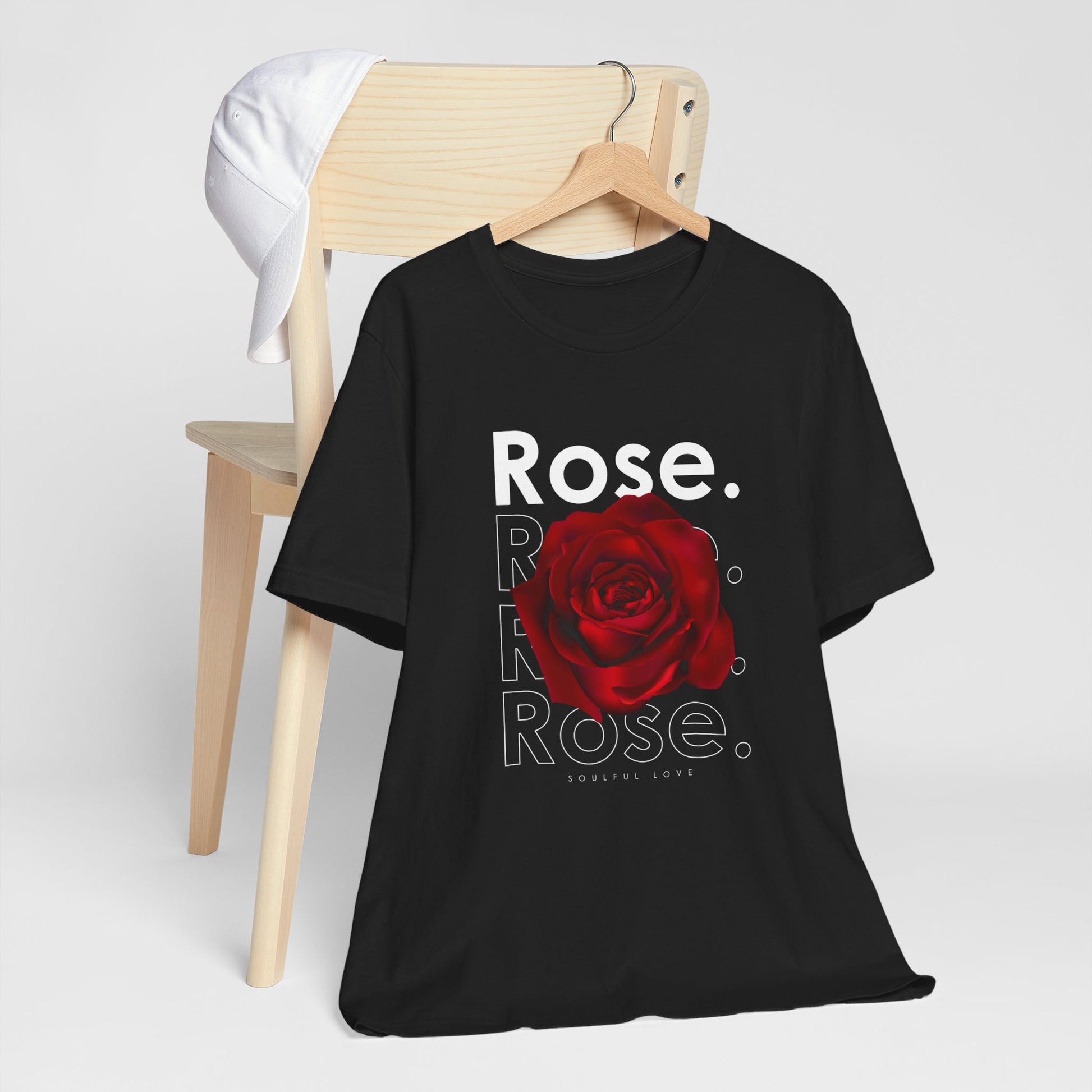 A t-shirt featuring a stunning deep red rose with the theme 'Soulful Love.' Perfect for those who adore bold floral art and nature. Comfortable and stylish for casual outings or celebrations. Bella+Canvas 3001 t-shirt in black. ReadyShirtAim.com