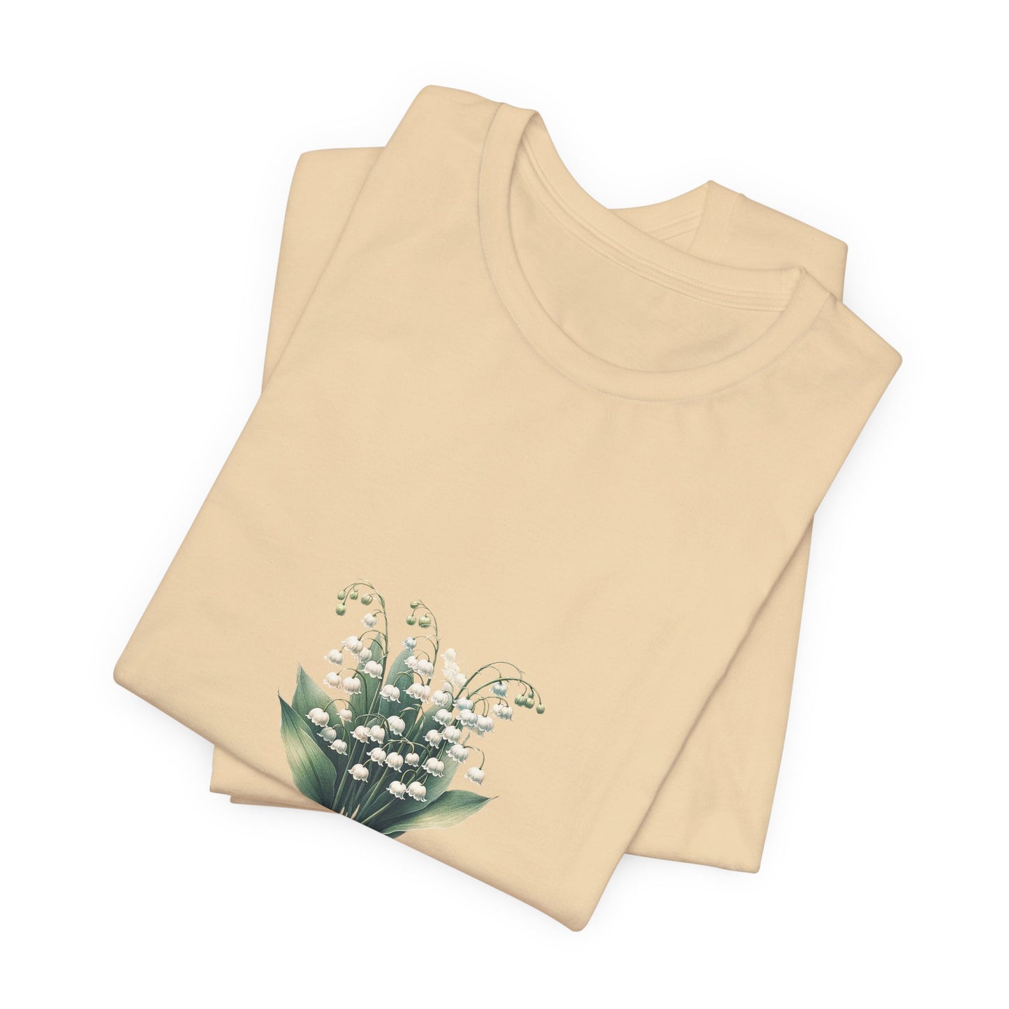 A t-shirt featuring a beautiful Lily of the Valley for May with the quote “Be your own reason to smile.” Perfect for May birthdays and floral art lovers. Comfortable and stylish for casual outings or celebrations. Bella+Canvas 3001 t-shirt in soft cream. ReadyShirtAim.com