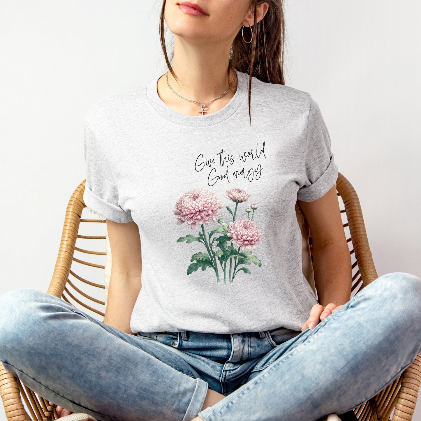 A t-shirt featuring a beautiful chrysanthemum for November with the quote “Give this world good energy.” Perfect for November birthdays and floral art lovers. Comfortable and stylish for casual outings or celebrations. Bella+Canvas 3001 t-shirt in ash. ReadyShirtAim.com