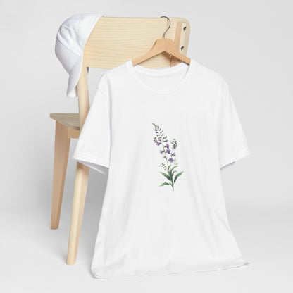 A t-shirt featuring a beautiful larkspur for July. Perfect for July birthdays and floral art lovers. Comfortable and stylish for casual outings or celebrations.Bella+Canvas 3001 t-shirt in white. ReadyShirtAim.com