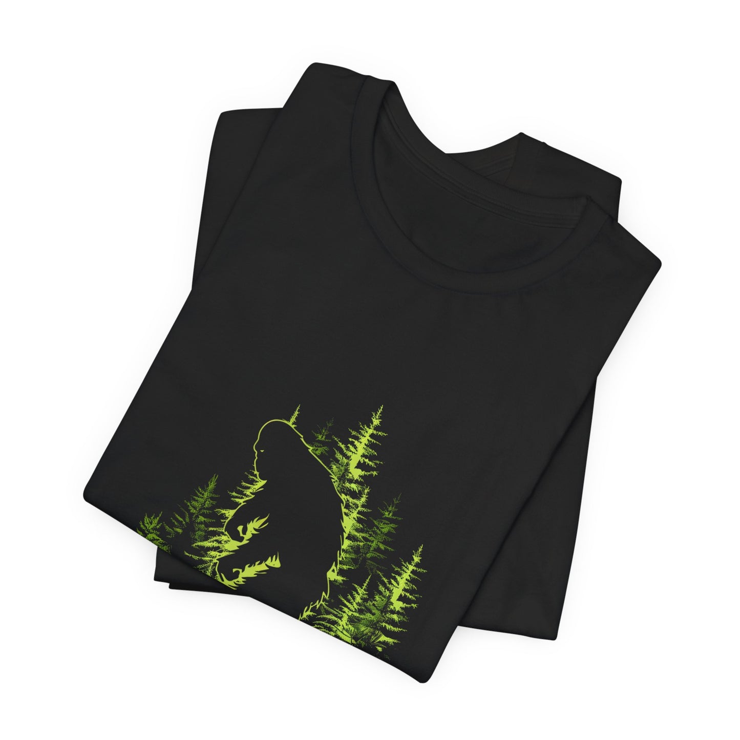 A t-shirt featuring an artistic depiction of a Bigfoot encounter, perfect for cryptid enthusiasts, outdoor adventurers, and mystery lovers. Comfortable and stylish for casual outings or cryptid conventions. Bella+Canvas 3001 t-shirt in black. ReadyShirtAim.com