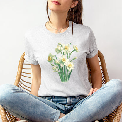 A t-shirt featuring a beautiful narcissus for December. Perfect for December birthdays and floral art lovers. Comfortable and stylish for casual outings or celebrations. Bella+Canvas 3001 t-shirt in white. ReadyShirtAim.com