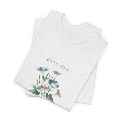 A t-shirt featuring a beautiful morning glory for September with traits Love, Affection, Mortality. Perfect for September birthdays and floral art lovers. Comfortable and stylish for casual outings or celebrations. Bella+Canvas 3001 t-shirt in ash. ReadyShirtAim.com