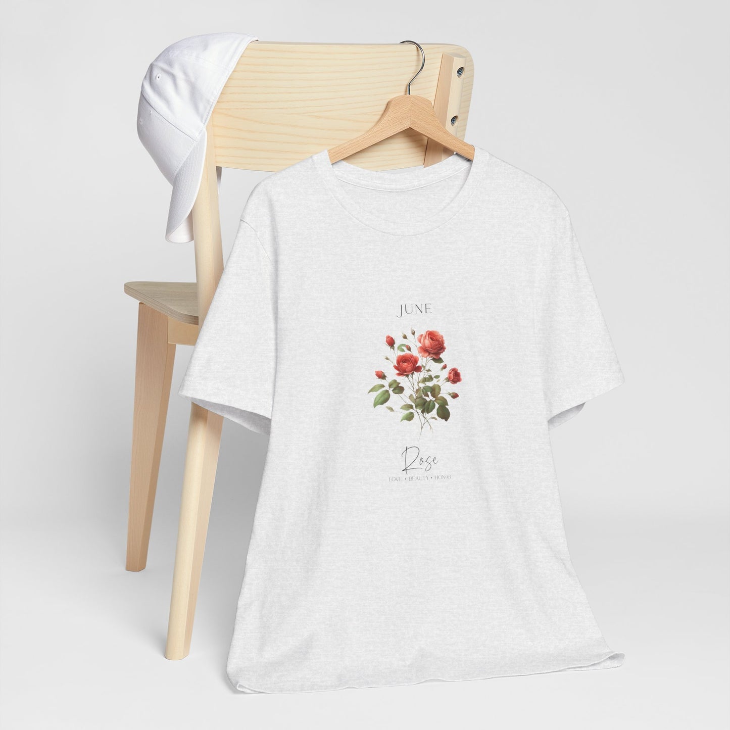 A t-shirt featuring a beautiful rose for June with traits Love, Beauty, Honor. Perfect for June birthdays and floral art lovers. Comfortable and stylish for casual outings or celebrations. Bella+Canvas 3001 t-shirt in ash. ReadyShirtAim.com