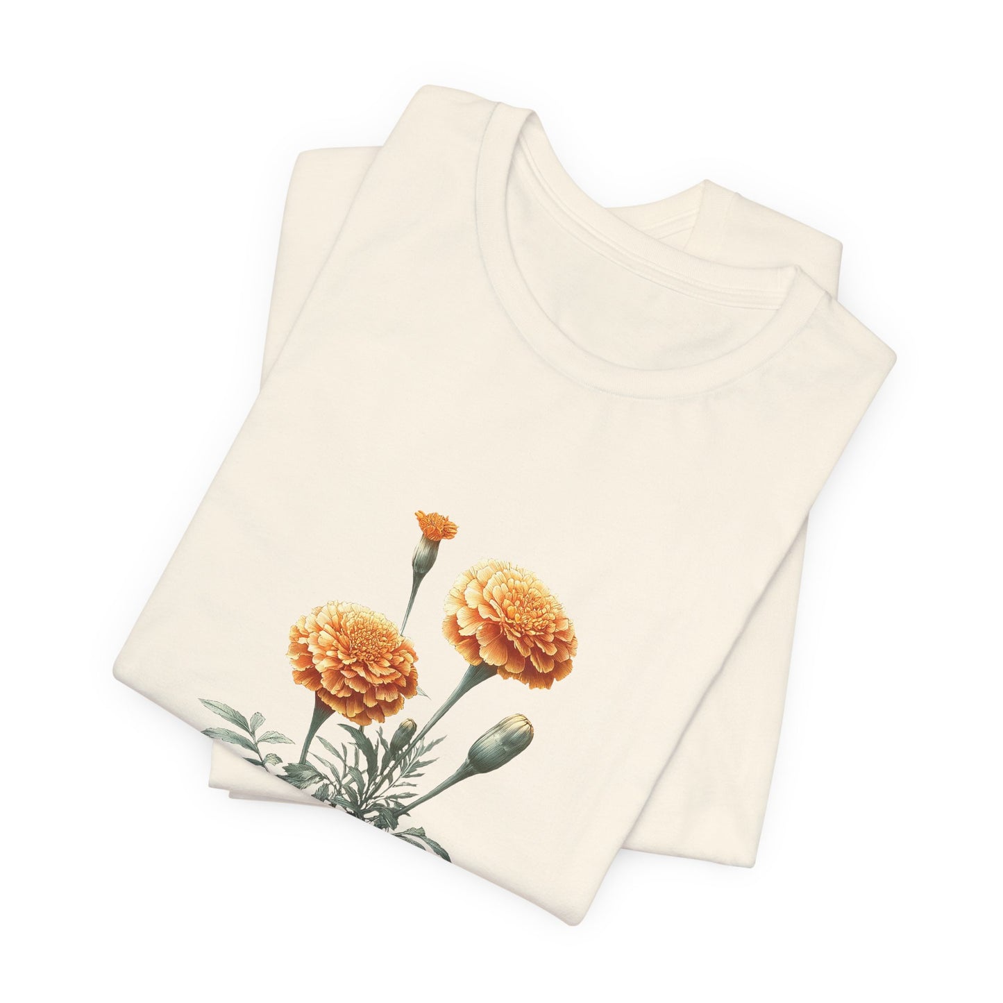 A t-shirt featuring a beautiful marigold for October. Perfect for October birthdays and floral art lovers. Comfortable and stylish for casual outings or celebrations. Bella+Canvas 3001 t-shirt in natural. ReadyShirtAim.com