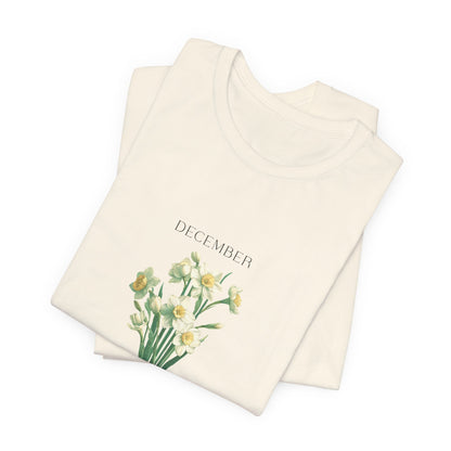 AA t-shirt featuring a beautiful narcissus for December with traits Faithfulness, Good Wishes, Respect. Perfect for December birthdays and floral art lovers. Comfortable and stylish for casual outings or celebrations. Bella+Canvas 3001 t-shirt in natural. ReadyShirtAim.com