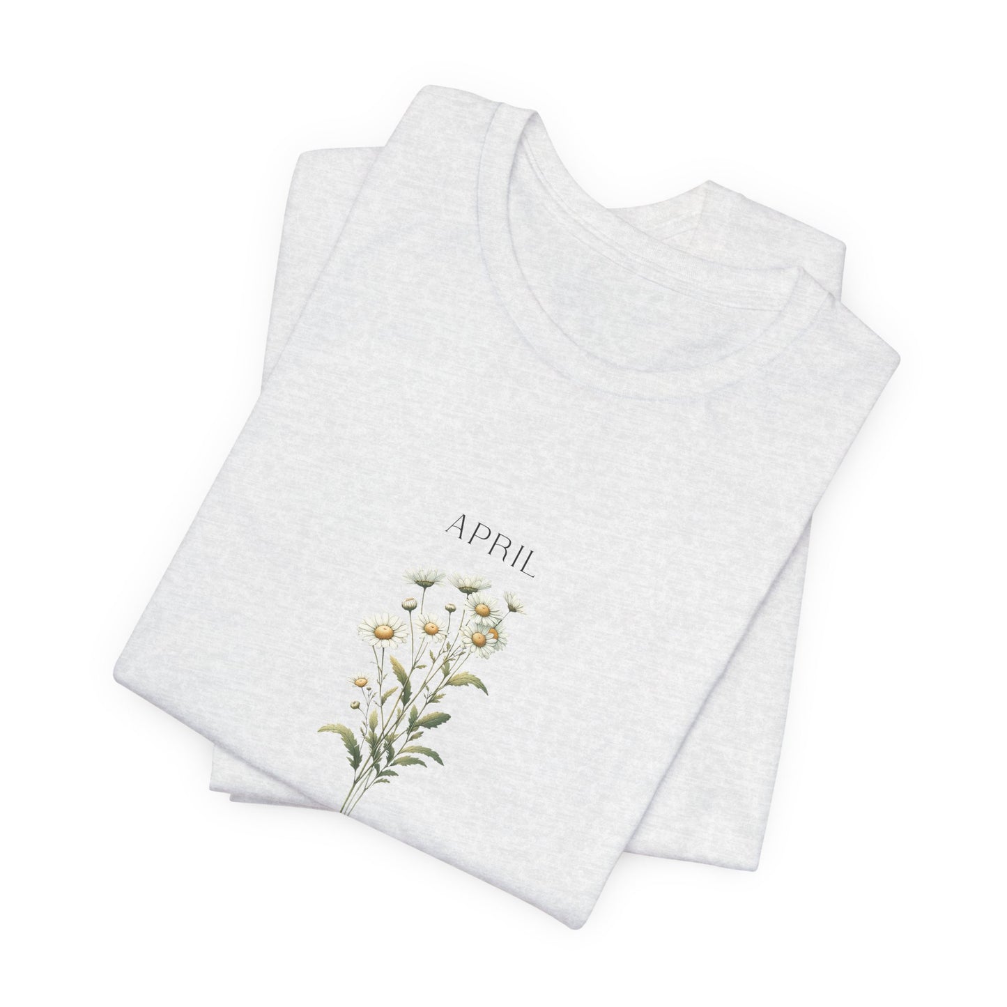 A t-shirt featuring a beautiful daisy for April with traits Purity, Innocence, Loyalty. Perfect for April birthdays and floral art lovers. Comfortable and stylish for casual outings or celebrations. Bella+Canvas 3001 t-shirt in ash. ReadyShirtAim.com