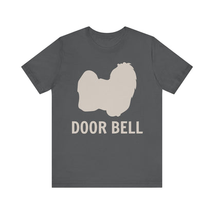 "Door Bell" Maltese Dog T-Shirt for Unisex with a beige silhouette of a Maltese dog and playful "Door Bell" text underneath. Ideal for dog lovers with a sense of humor. Available in multiple colors and sizes. Bella+Canvas 3001 t-shirt in asphalt. ReadyShirtAim.com