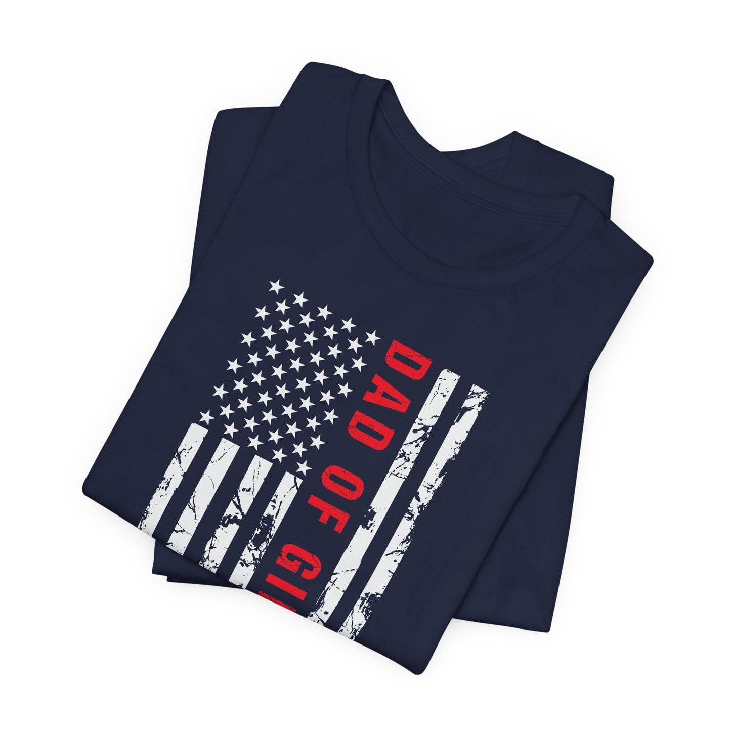 A dark-colored t-shirt featuring a grungy American flag design with the text "Dad of girls #outnumbered" in white and red. Perfect for Father's Day, Fourth of July, and patriotic dads who love humor. Comfortable and stylish for casual wear. Bella+Canvas 3001 t-shirt in navy. ReadyShirtAim.com