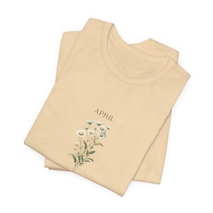 A t-shirt featuring a beautiful daisy for April with traits Purity, Innocence, Loyalty. Perfect for April birthdays and floral art lovers. Comfortable and stylish for casual outings or celebrations. Bella+Canvas 3001 t-shirt in soft cream. ReadyShirtAim.com