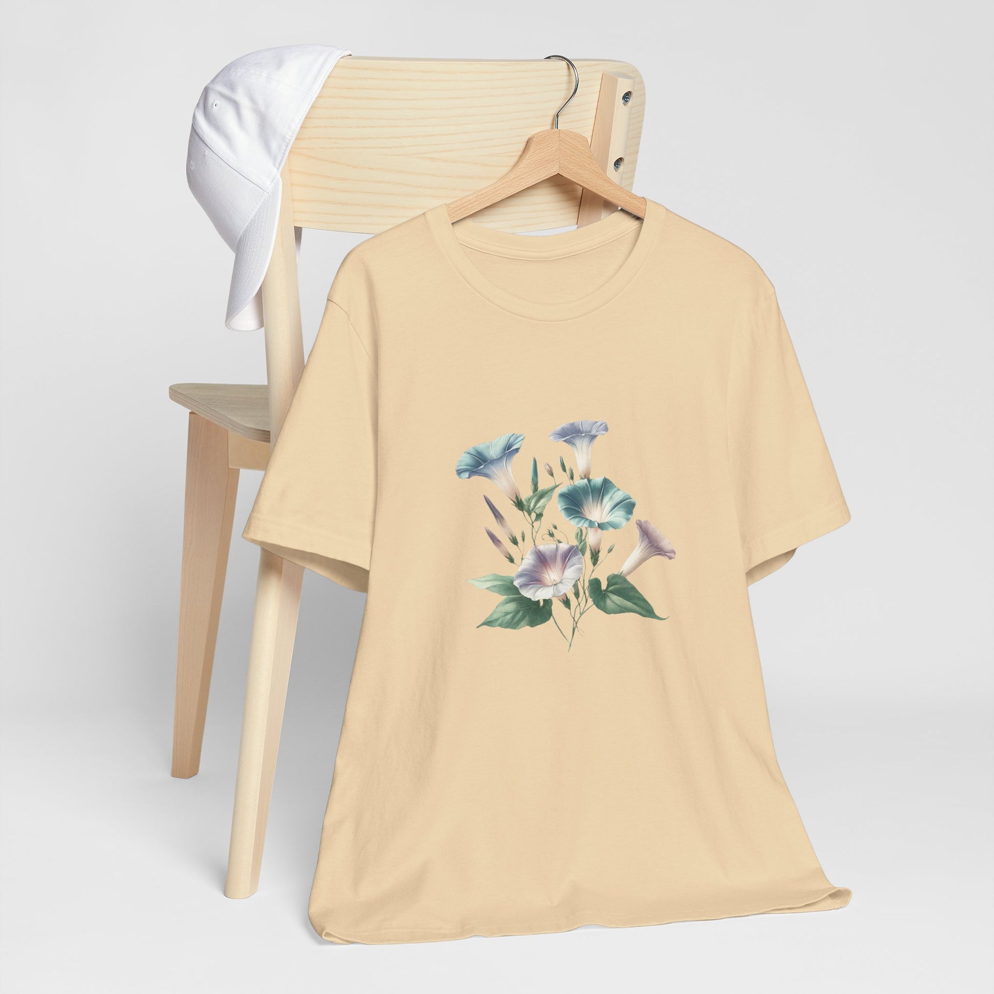 A t-shirt featuring a beautiful morning glory for September. Perfect for September birthdays and floral art lovers. Comfortable and stylish for casual outings or celebrations. Bella+Canvas 3001 t-shirt in soft cream. ReadyShirtAim.com