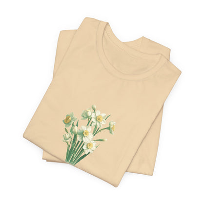 A t-shirt featuring a beautiful narcissus for December with the quote “Peaceful mind, grateful heart.” Perfect for December birthdays and floral art lovers. Comfortable and stylish for casual outings or celebrations. Bella+Canvas 3001 t-shirt in soft cream. ReadyShirtAim.com