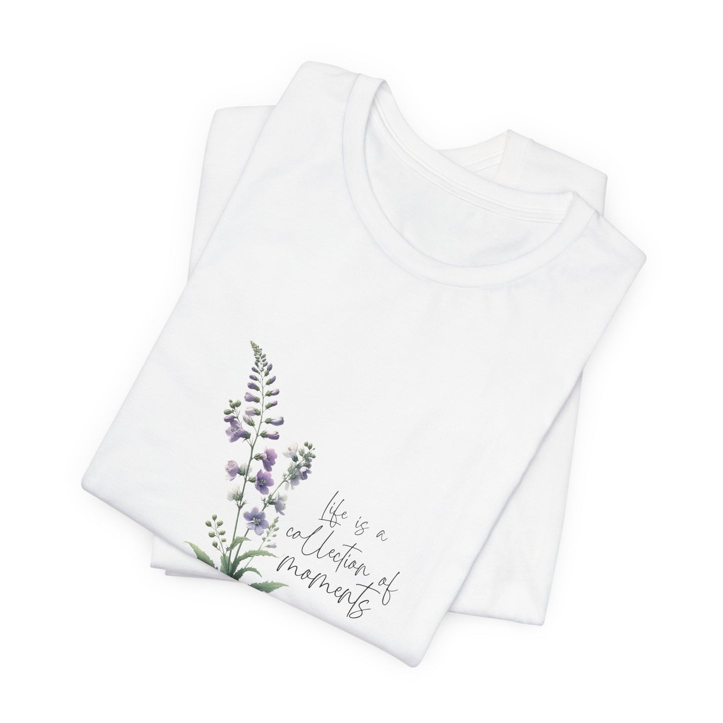 A t-shirt featuring a beautiful larkspur for July with the quote “Life is a collection of moments.” Perfect for July birthdays and floral art lovers. Comfortable and stylish for casual outings or celebrations.. Bella+Canvas 3001 t-shirt in white. ReadyShirtAim.com