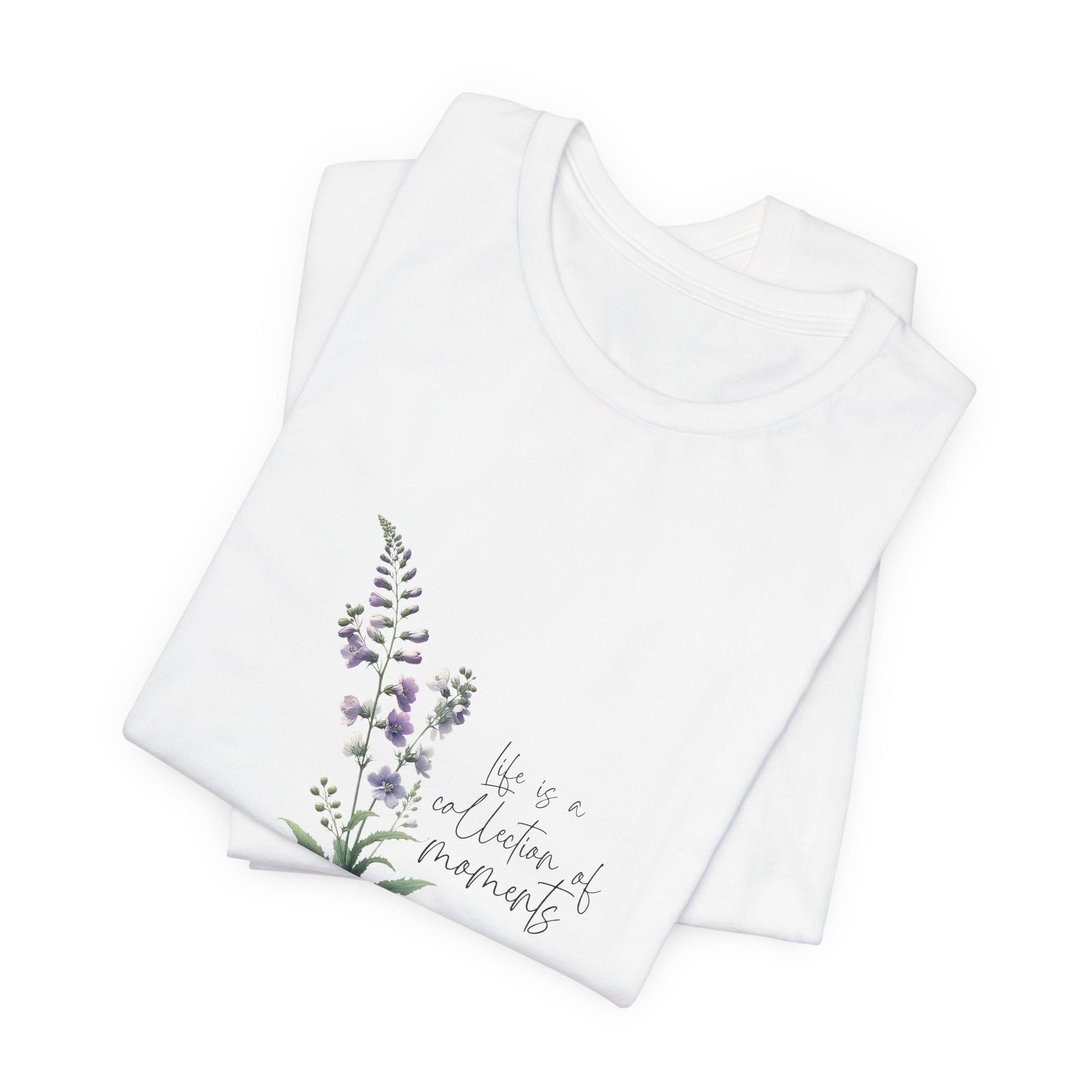 A t-shirt featuring a beautiful larkspur for July with the quote “Life is a collection of moments.” Perfect for July birthdays and floral art lovers. Comfortable and stylish for casual outings or celebrations.. Bella+Canvas 3001 t-shirt in white. ReadyShirtAim.com