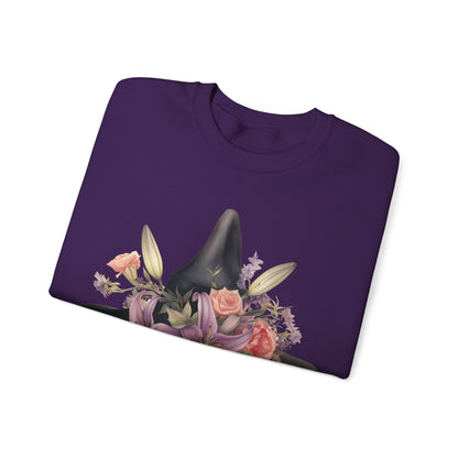 Elegant Witchy Blooms Sweatshirt with a watercolor illustration of a black witch hat and flowers in purple, pink, and green. Available in multiple dark and light colors and sizes. Gildan 18000 sweatshirt in Purple. ReadyShirtAim.com