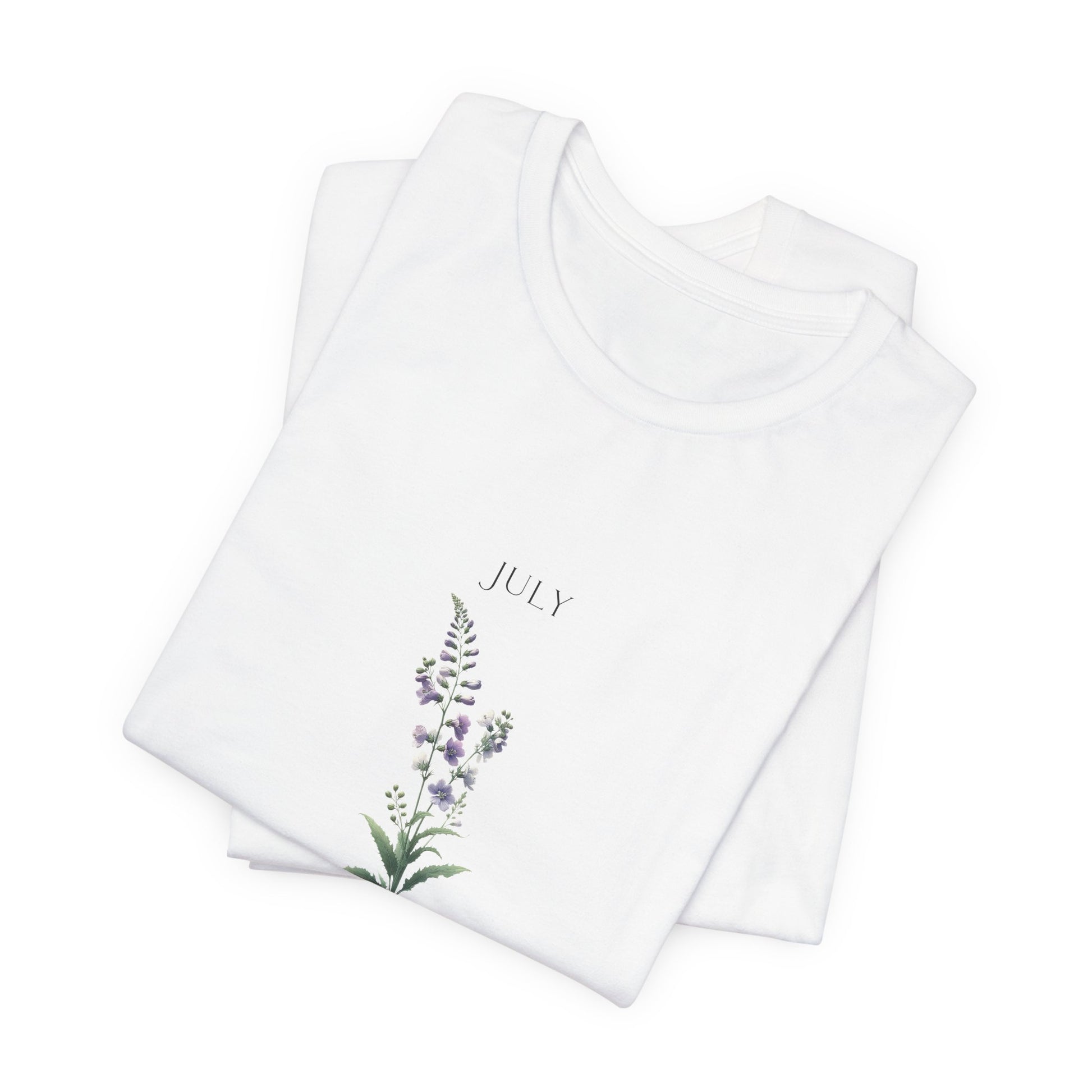 A t-shirt featuring a beautiful larkspur for July with traits Positive, Grace, First Love. Perfect for July birthdays and floral art lovers. Comfortable and stylish for casual outings or celebrations. Bella+Canvas 3001 t-shirt in white. ReadyShirtAim.com