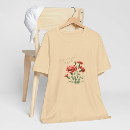 A t-shirt featuring a beautiful carnation for January with the quote “She believed she could, so she did.” Perfect for January birthdays and floral art lovers. Comfortable and stylish for casual outings or celebrations. Bella+Canvas 3001 t-shirt in soft cream. ReadyShirtAim.com