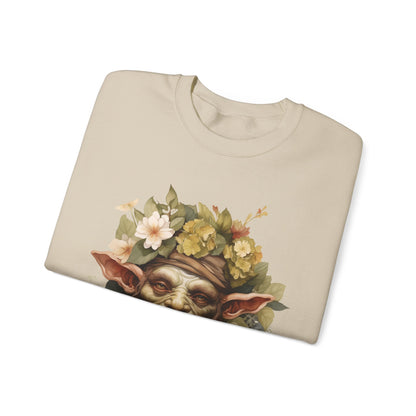 Creepy Cute Goblin Floral Boho Halloween Sweatshirt for women. Features a charming goblin surrounded by muted florals. Perfect for Halloween celebrations. Available in multiple dark and light colors and sizes. Gildan 18000 sweatshirt in Sand. ReadyShirtAim.com